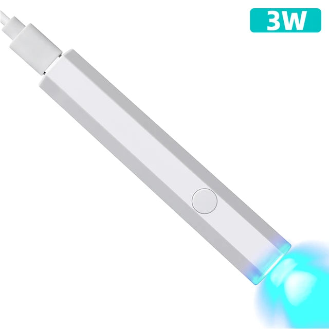 White compact nail lamp for travel emitting blue light with USB charging port and power button