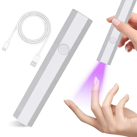 Compact nail lamp for travel with USB charging cable curing purple light on fingernail