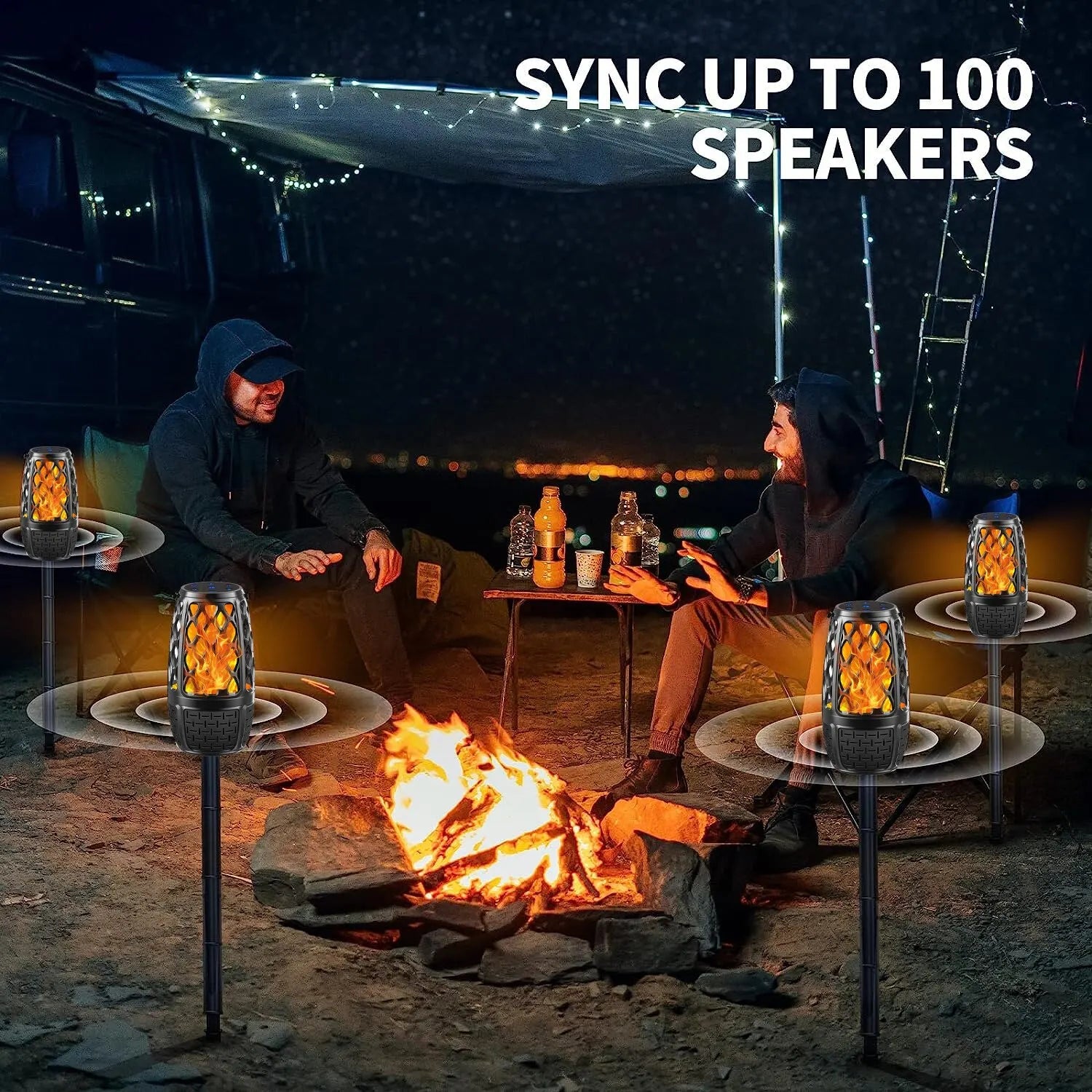 Outdoor campfire scene with two people and multiple flame bluetooth speakers syncing sound around them