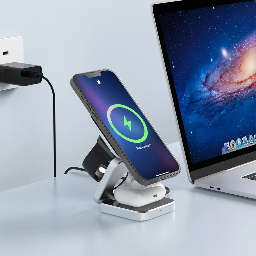 Sleek multi-device charging station with smartphone and wireless earbuds charging next to laptop