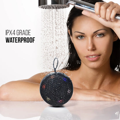 Portable Bluetooth speaker with IPX4 grade waterproof rating shown in shower setting