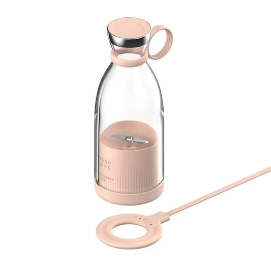 Pink portable juicer blender with transparent body and USB charging cable for easy blending