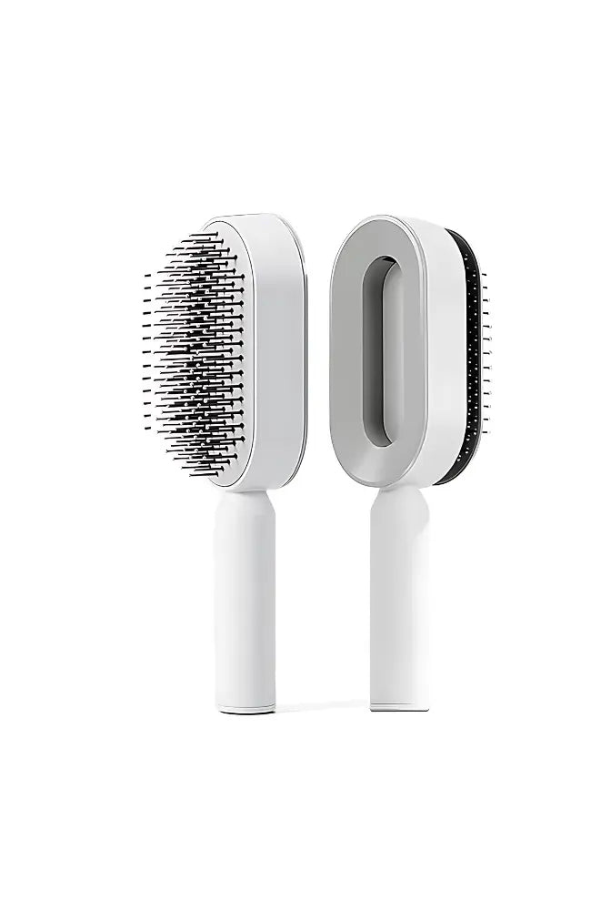White self-cleaning hair brush with ergonomic handle shown from front and back